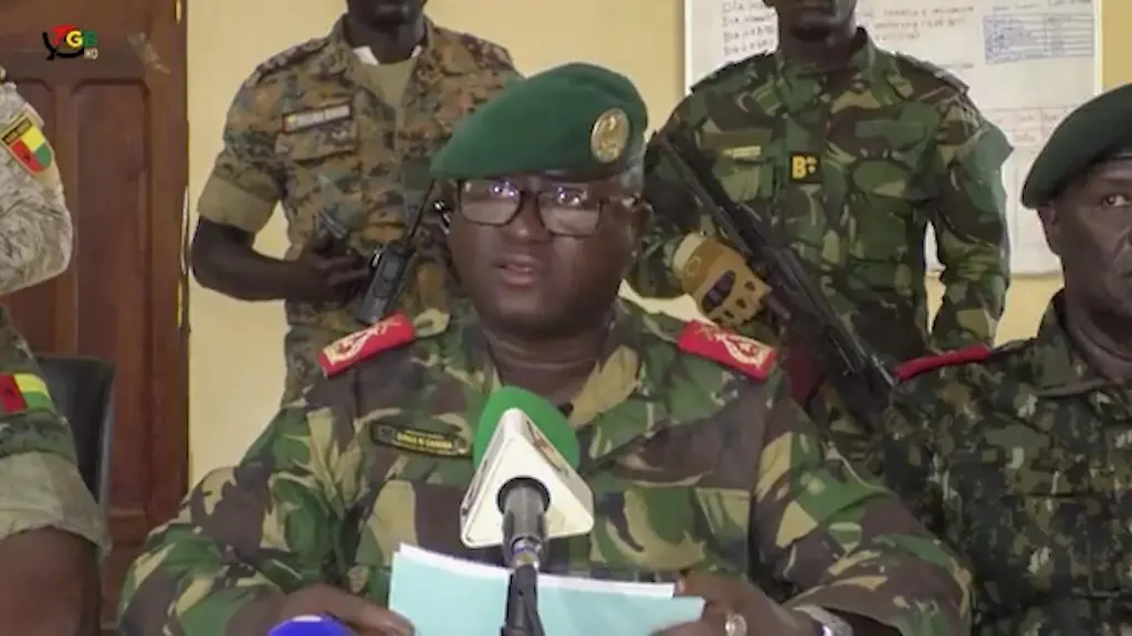 BISSAU-GUINEA-BISSAU-NOVEMBER-26-EDITORIAL-USE-ONLY-MANDATORY-CREDIT-AA-VIDEO-HANDOUT-NO-MARKETING-NO-ADVERTISING-CAMPAIGNS-DISTRIBUTED-AS-A-SERVICE-TO-CLIENTS-A-screen-grab-shows-the-Head-of-the-Presidential-Military-Office-of-Guinea-Bissau-Denis-NAeoCanha-C-announcing-with-a-group-of-officers-that-full-control-of-the-country-had-been-taken-at-the-General-Staff-Headquarters-in-Bissau-Guinea-Bissau-on-November-26-2025