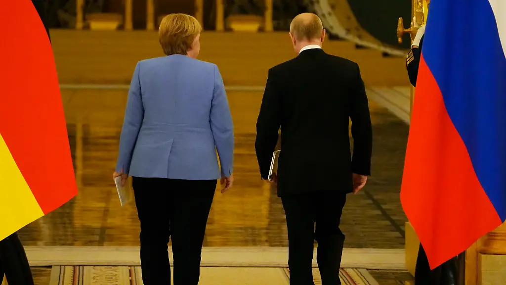 Russian-President-Vladimir-Putin-right-and-German-Chancellor-Angela-Merkel-leave-a-joint-news-conference-following-their-talks-in-the-Kremlin-in-Moscow-Russia-Friday-Aug-20-2021-The-talks-between-Merkel-and-Putin-are-expected-to-focus-on-Afghanistan-the-Ukrainian-crisis-and-the-situation-in-Belarus-among-other-issues