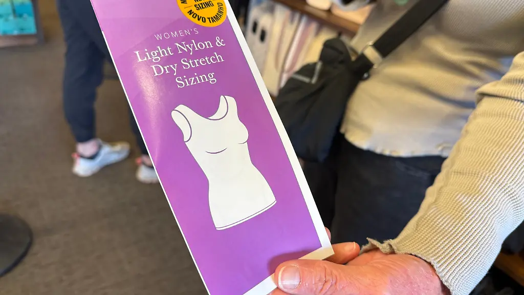 A-woman-holds-a-pamphlet-for-the-new-sleeveless-sacred-garments-worn-by-members-of-The-Church-of-Jesus-Christ-of-Latter-day-Saints-at-Deseret-Book-in-Salt-Lake-City-on-Tuesday-Oct-28-2025