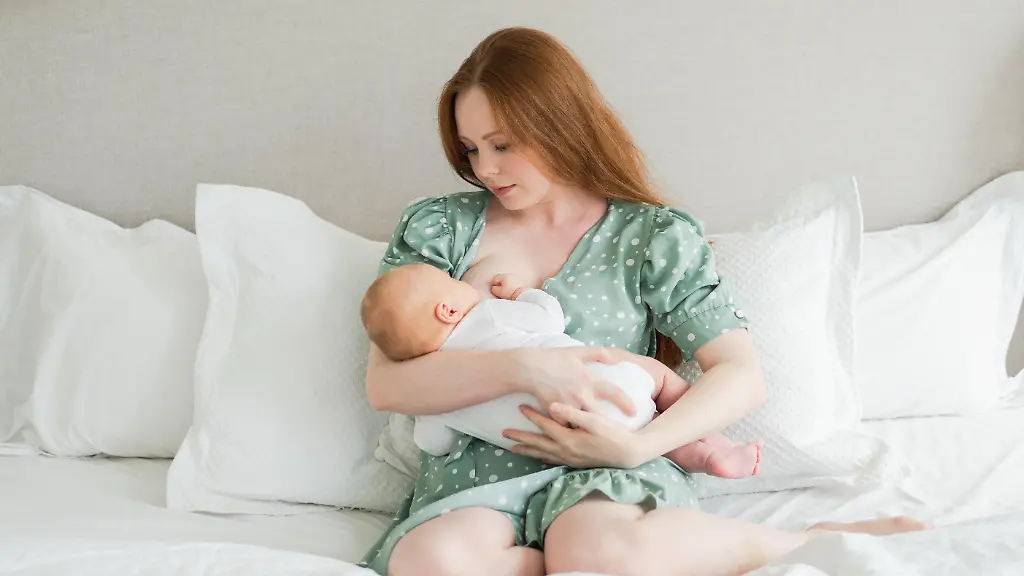 Happy-family-at-home-Mother-breastfeeding-baby-for-health-nutrition-wellness-Mom-nursing-feeding-her-newborn-child-milk-at-home
