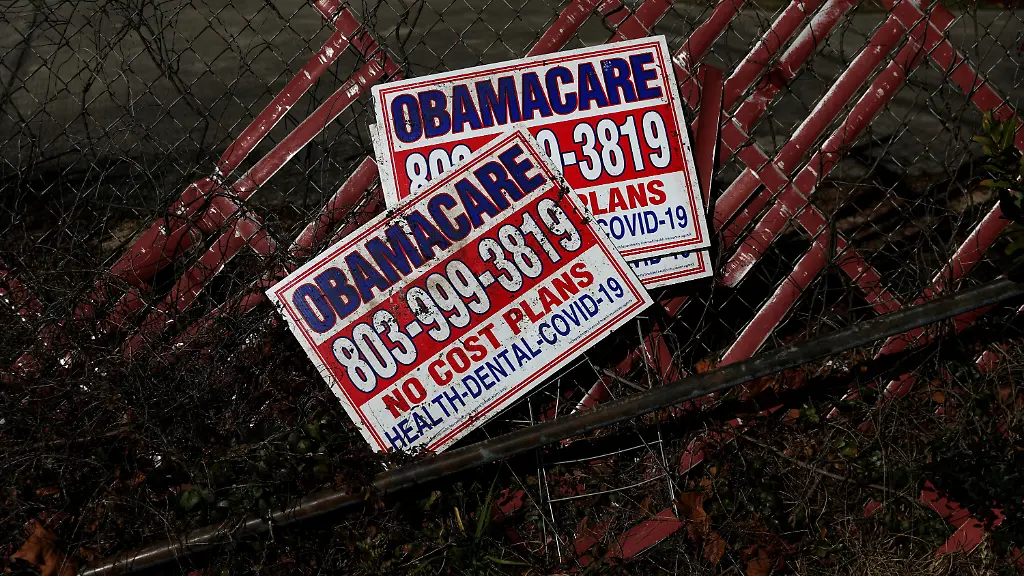 FILE-PHOTO-Signs-for-former-Obamacare-health-insurance-plans-lay-next-to-a-fence-in-Columbia-South-Carolina-U-S-January-28-2023