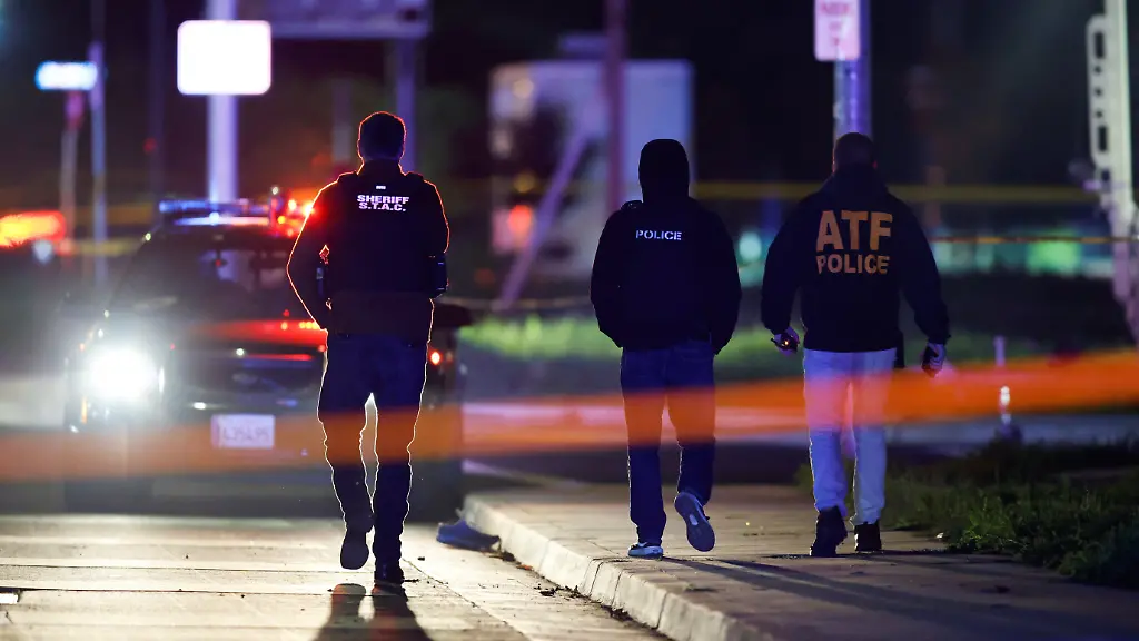 Members-of-the-police-walk-at-the-scene-after-several-people-were-shot-at-a-family-gathering-in-Stockton-California-U-S-November-29-2025