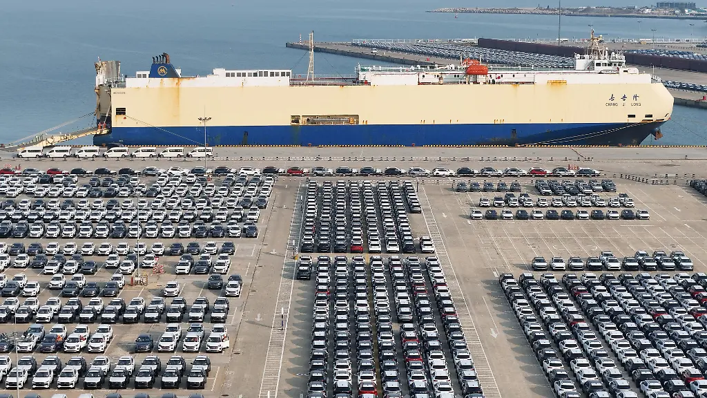 Chinese-made-vehicles-are-gathered-at-Yantai-Port-waiting-to-be-loaded-onto-ships-for-export-overseas-in-Yantai-City-Shandong-Province-China-on-November-12-2025
