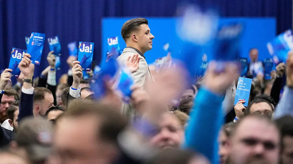 New-elected-leader-Jean-Pascal-Hohm-of-the-AfD-youth-party-Generation-Deutschland-walks-through-the-assembly-during-the-re-founding-of-the-AfD-youth-organization-in-Giessen-Germany-Saturday-Nov-29-2025