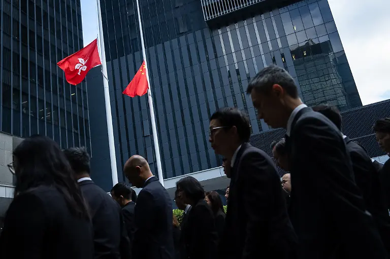 Chinese-and-Hong-Kong-Special-Administrative-Region-flags-fly-at-half-mast-to-mourn-the-victims-of-the-deadly-fire-that-started-Wednesday-at-Wang-Fuk-Court-a-residential-estate-in-the-Tai-Po-district-of-Hong-Kong-s-New-Territories-Saturday-Nov-29-2025