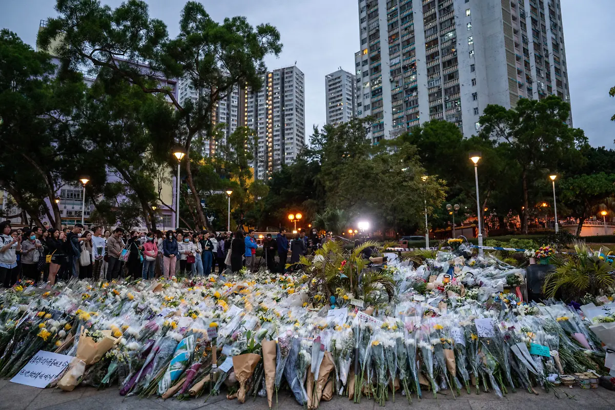November-30-2025-Hong-Kong-Hong-Kong-Flowers-at-a-makeshift-memorial-near-Wang-Fuk-Court-housing-complex-in-Tai-Po-following-a-deadly-fire-on-November-30-2025-in-Hong-Kong