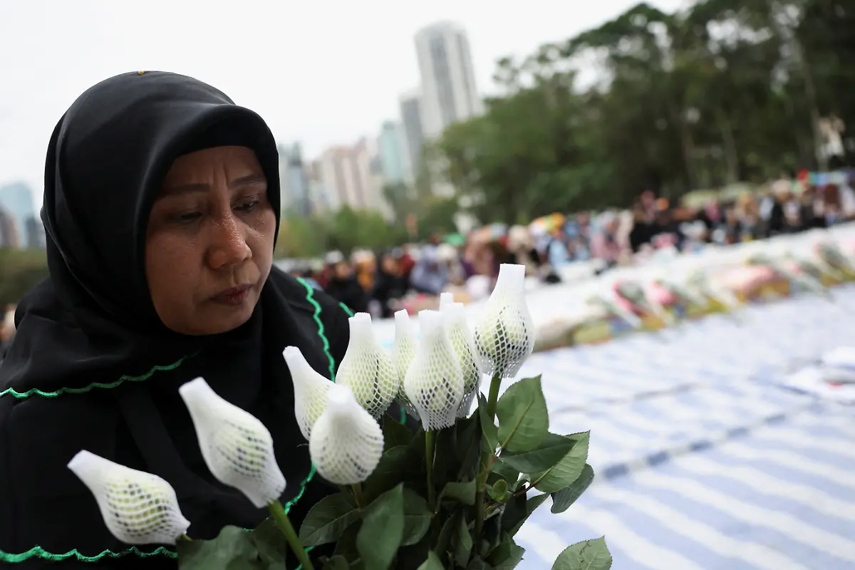 A-mourner-attends-a-Muslim-prayer-gathering-organized-by-the-Indonesian-community-for-victims-of-the-deadly-fire-that-occurred-on-Wednesday-at-the-Wang-Fuk-Court-housing-complex-in-Tai-Po-in-Hong-Kong-China-November-30-2025