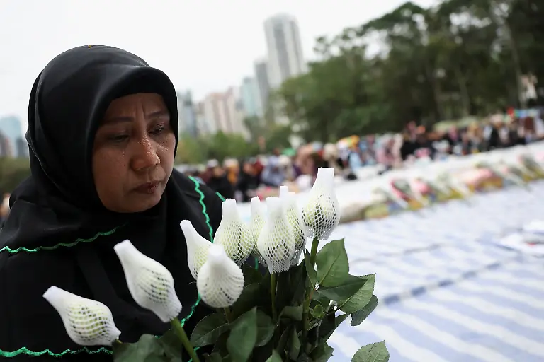A-mourner-attends-a-Muslim-prayer-gathering-organized-by-the-Indonesian-community-for-victims-of-the-deadly-fire-that-occurred-on-Wednesday-at-the-Wang-Fuk-Court-housing-complex-in-Tai-Po-in-Hong-Kong-China-November-30-2025