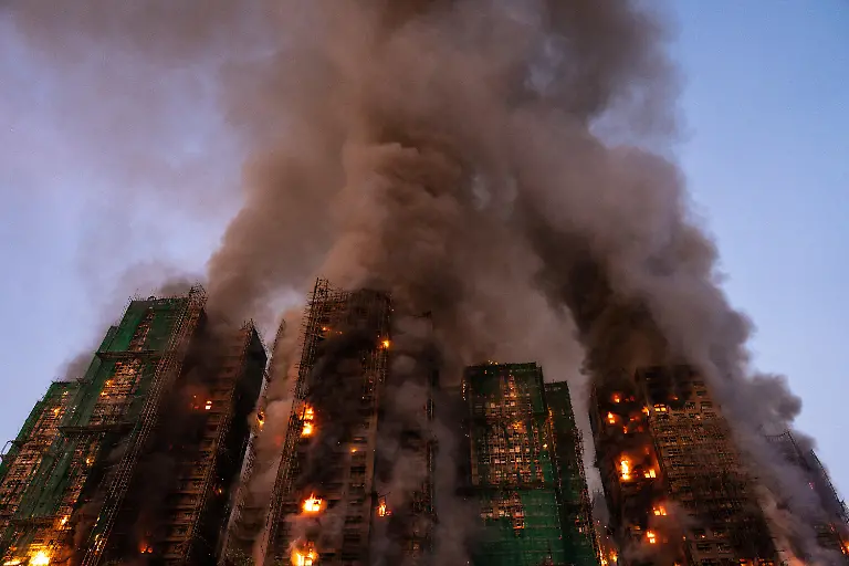 November-26-2025-Hong-Kong-Hong-Kong-Smoke-and-flames-rise-as-a-major-fire-engulfs-several-residential-buildings-at-Wang-Fuk-Court-on-November-26-2025-in-Hong-Kong-Serval-residential-building-in-Wang-Fuk-Court-located-in-Tai-Po-District-caught-fire-today-the-Hong-Kong-Fire-Department-has-issued-the-No-5-fire-alarm-the-fire-at-local-time-1800-has-claimed-the-life-of-one-firefighter-and-three-other-people