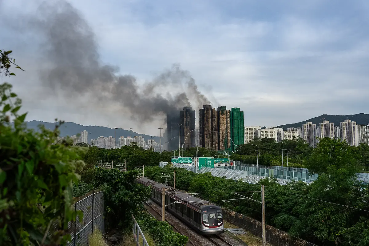 Smoke-rises-after-a-fire-broke-out-at-Wang-Fuk-Court-a-residential-estate-in-the-Tai-Po-district-of-Hong-Kong-s-New-Territories-Thursday-Nov-27-2025