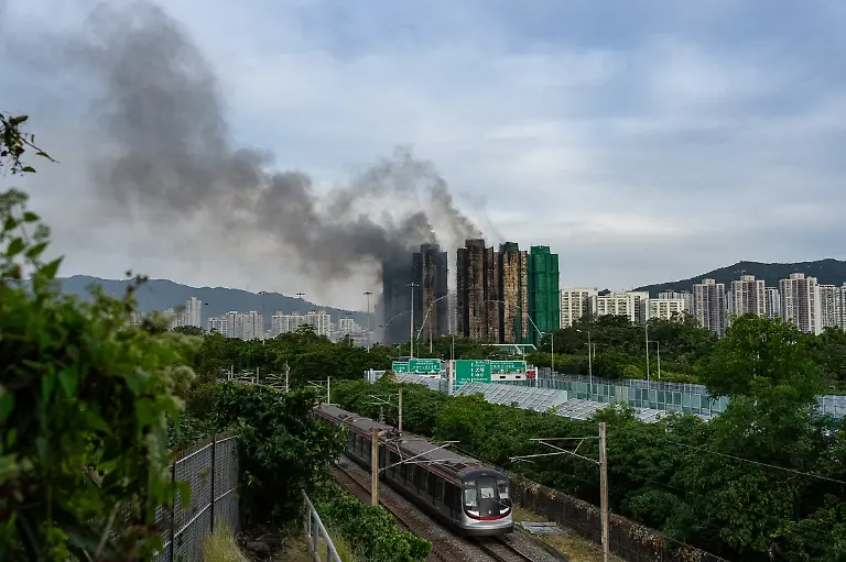 Smoke-rises-after-a-fire-broke-out-at-Wang-Fuk-Court-a-residential-estate-in-the-Tai-Po-district-of-Hong-Kong-s-New-Territories-Thursday-Nov-27-2025