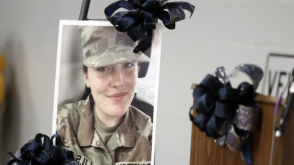A-picture-of-National-Guard-member-Specialist-Sarah-Beckstrom-one-of-two-National-Guard-members-who-were-shot-in-Washington-on-Wednesday-is-honored-with-blue-bows-in-Webster-Springs-W-Va-Friday-Nov-28-2025
