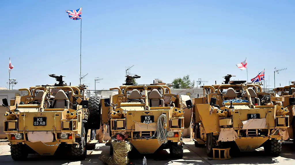 Afghanistan-exit-preparations-An-Army-engineer-fixes-the-headlight-of-a-Jackal-before-the-vehicle-is-redeployed-to-the-UK-after-returning-from-the-battlefield-at-Camp-Bastion-Afghanistan-Picture-date-Saturday-March-30-2013-See-PA-story-DEFENCE-Afghanistan
