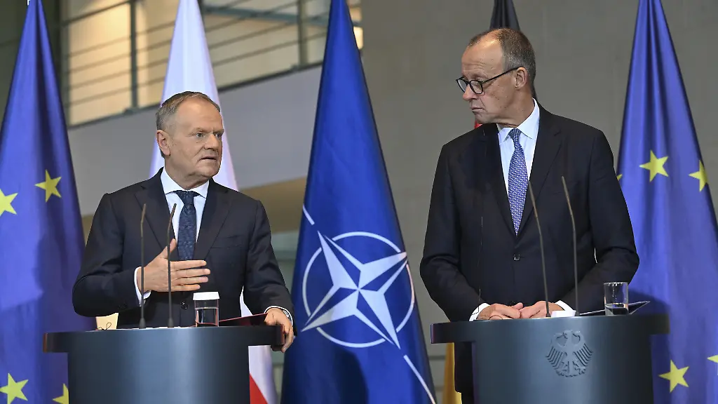 BERLIN-GERMANY-DECEMBER-01-Polish-Prime-Minister-Donald-Tusk-and-German-Chancellor-Friedrich-Merz-hold-a-joint-press-conference-in-Berlin-Germany-on-December-01-2025