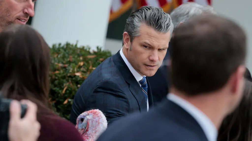 U-S-Secretary-of-Defense-Pete-Hegseth-looks-at-Gobble-one-of-two-turkeys-ceremonially-pardoned-for-Thanksgiving-in-the-Rose-Garden-at-the-White-House-in-Washington-D-C-U-S-November-25-2025