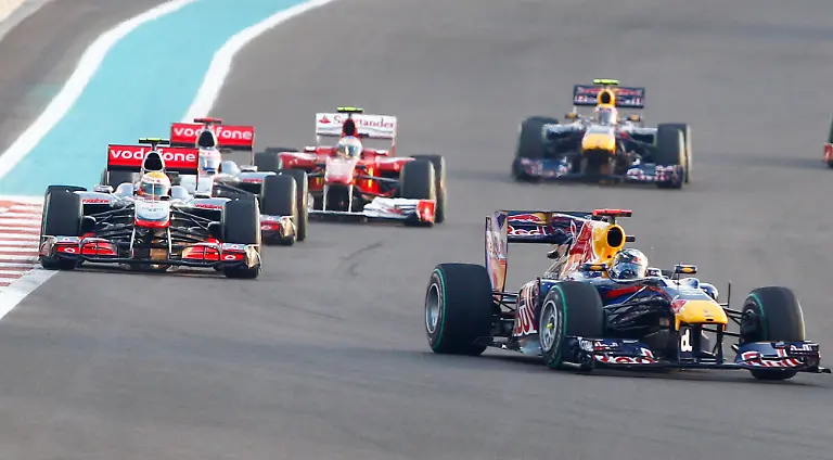 Red-Bull-driver-Sebastian-Vettel-of-Germany-leads-McLaren-Mercedes-driver-Lewis-Hamilton-of-Britain-McLaren-Mercedes-driver-Jenson-Button-of-Britain-and-Ferrari-driver-Fernando-Alonso-of-Spain-and-Red-Bull-driver-Mark-Webber-of-Australia-during-the-Emirates-Formula-One-Grand-Prix-at-the-Yas-Marina-racetrack-in-Abu-Dhabi-United-Arab-Emirates-Sunday-Nov-14-2010