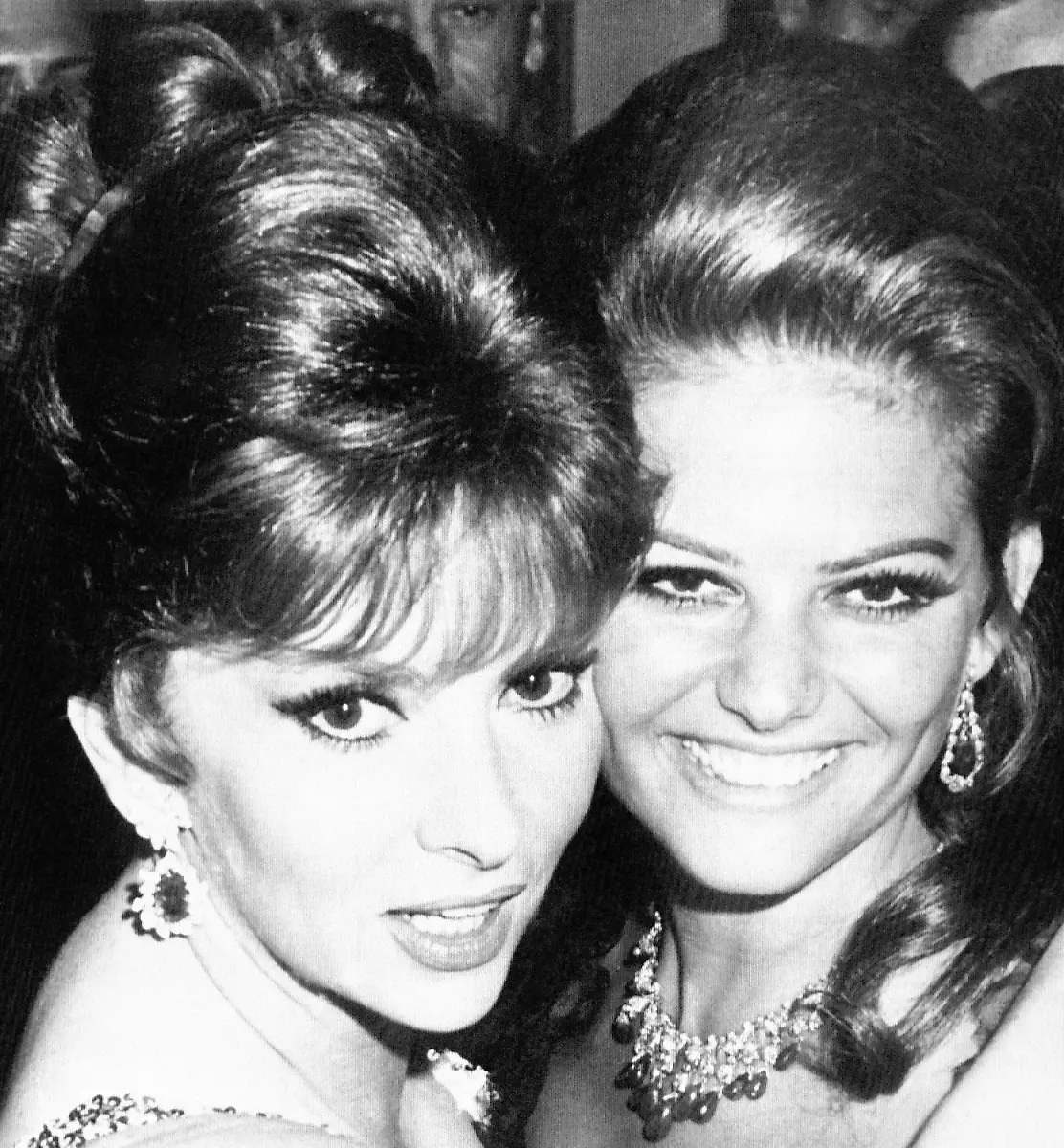 A-pair-of-Queens-is-a-pretty-sight-in-the-eyes-of-a-poker-player-But-a-pair-of-film-queens-like-Gina-Lollobrigida-left-and-Claudia-Cardinale-is-a-pretty-sight-in-nearly-anyoneas-eyes-The-two-got-together-at-a-dinner-Miss-Lollobrigida-gave-in-her-Rome-Villa-Oct-19-1966-honoring-former-presidential-aide-Jack-Valenti-who-is-now-President-of-the-motion-picture-association-of-America
