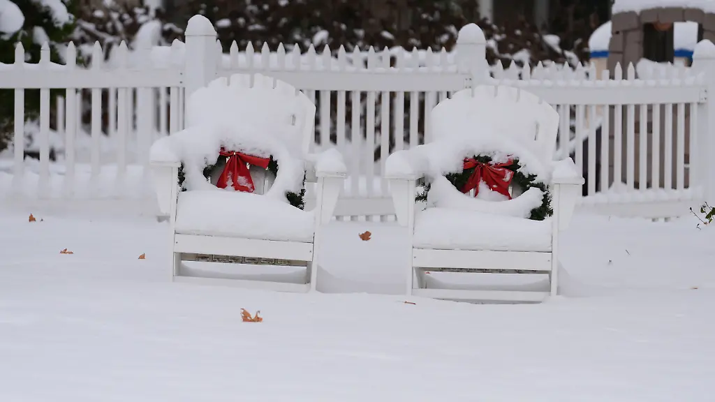 Chairs-are-covered-in-snow-in-Glenview-Ill-Monday-Dec-1-2025-AP-Photo-Nam-Y