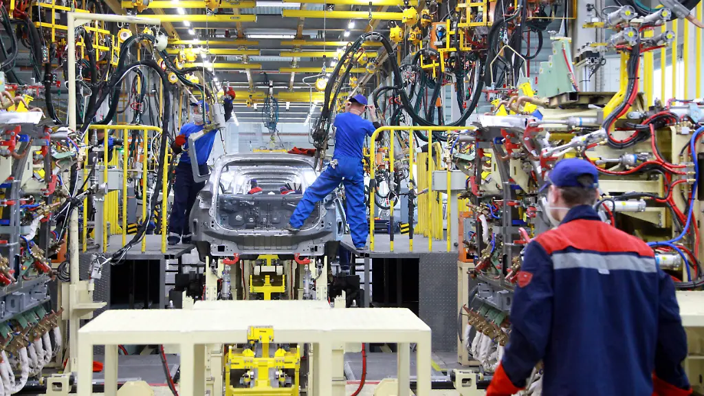 KALININGRAD-RUSSIA-APRIL-15-2020-Workers-weld-a-body-of-a-car-on-a-welding-line-at-a-factory-of-the-car-manufacturer-Avtotor-On-30-March-2020-the-plant-suspended-operation-after-the-Russian-government-declared-a-paid-period-off-work-in-connection-of-the-COVID-19-pandemic-In-line-with-the-decision-taken-by-the-local-government-the-Avtotor-factory-resumed-operation-on-13-April-2020