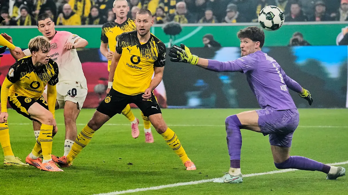 Leverkusen-s-Ibrahim-Maza-second-from-left-scores-the-opening-goal-during-the-German-Soccer-Cup-round-of-sixteen-soccer-match-between-Borussia-Dortmund-and-Bayer-04-Leverkusen-in-Dortmund-Germany-Tuesday-Dec-2-2025