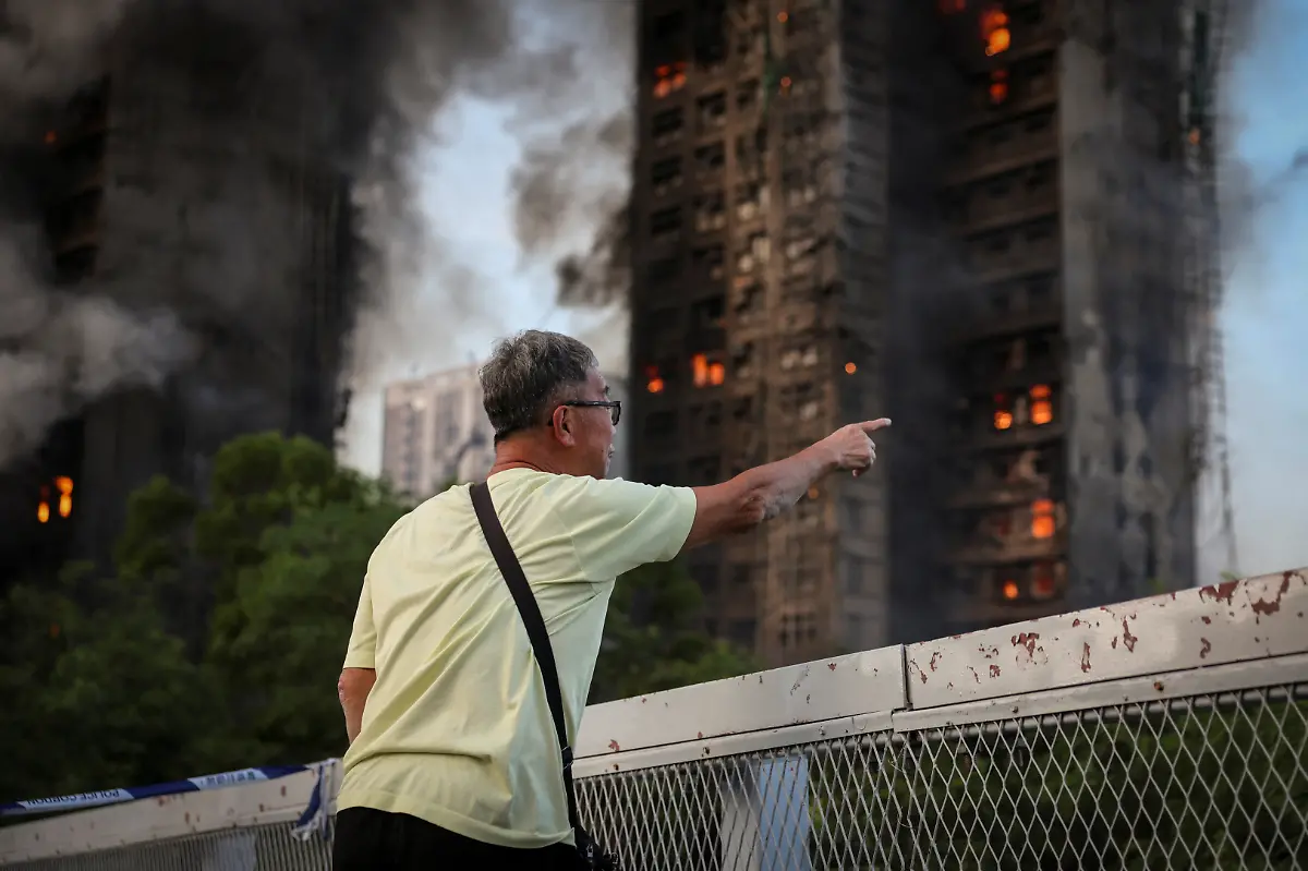 Wong-71-reacts-after-saying-his-wife-is-trapped-inside-Wang-Fuk-Court-during-a-major-fire-in-Tai-Po-Hong-Kong-China-November-26-2025-REUTERS-Tyrone-Siu-SEARCH-HONG-KONG-FIRE-PICTURE-FOR-THIS-STORY-SEARCH-WIDER-IMAGE-FOR-ALL-STORIES