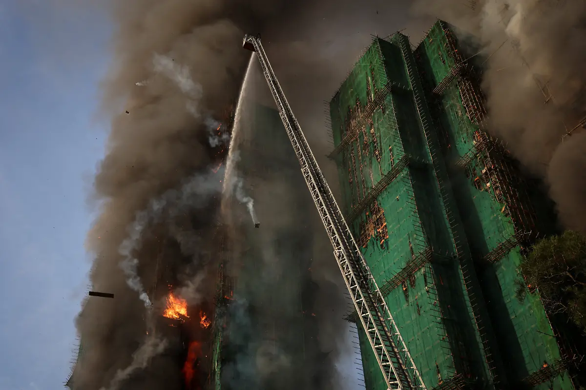 Flames-and-thick-smoke-rise-from-multiple-residential-blocks-at-the-Wang-Fuk-Court-housing-complex-during-a-deadly-fire-in-Tai-Po-Hong-Kong-China-November-26-2025-REUTERS-Tyrone-Siu-SEARCH-HONG-KONG-FIRE-PICTURE-FOR-THIS-STORY-SEARCH-WIDER-IMAGE-FOR-ALL-STORIES