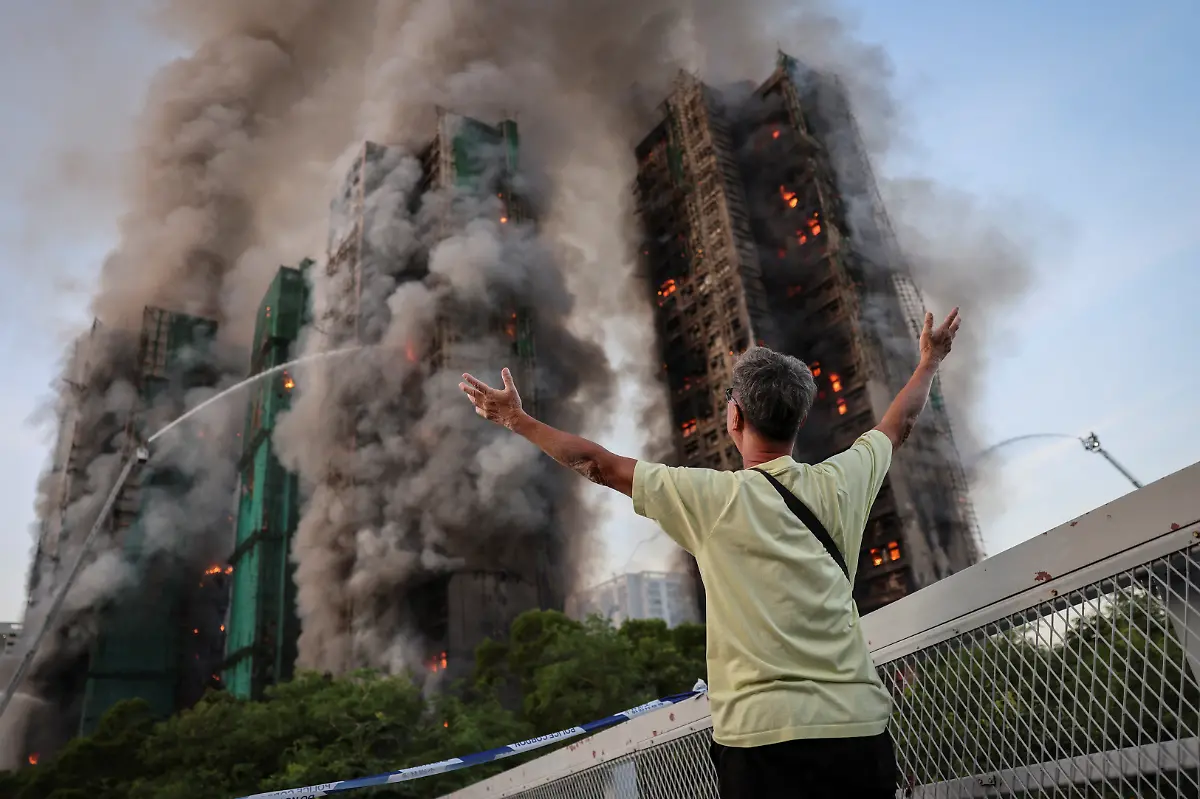 Wong-71-reacts-after-saying-his-wife-is-trapped-inside-Wang-Fuk-Court-during-a-major-fire-in-Tai-Po-Hong-Kong-China-November-26-2025-REUTERS-Tyrone-Siu-SEARCH-HONG-KONG-FIRE-PICTURE-FOR-THIS-STORY-SEARCH-WIDER-IMAGE-FOR-ALL-STORIES