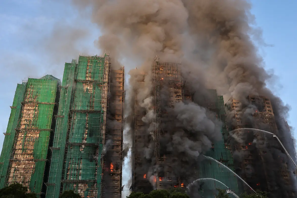 Flames-and-thick-smoke-rise-from-multiple-residential-blocks-at-the-Wang-Fuk-Court-housing-complex-during-a-deadly-fire-in-Tai-Po-Hong-Kong-China-November-26-2025-REUTERS-Tyrone-Siu-SEARCH-HONG-KONG-FIRE-PICTURE-FOR-THIS-STORY-SEARCH-WIDER-IMAGE-FOR-ALL-STORIES