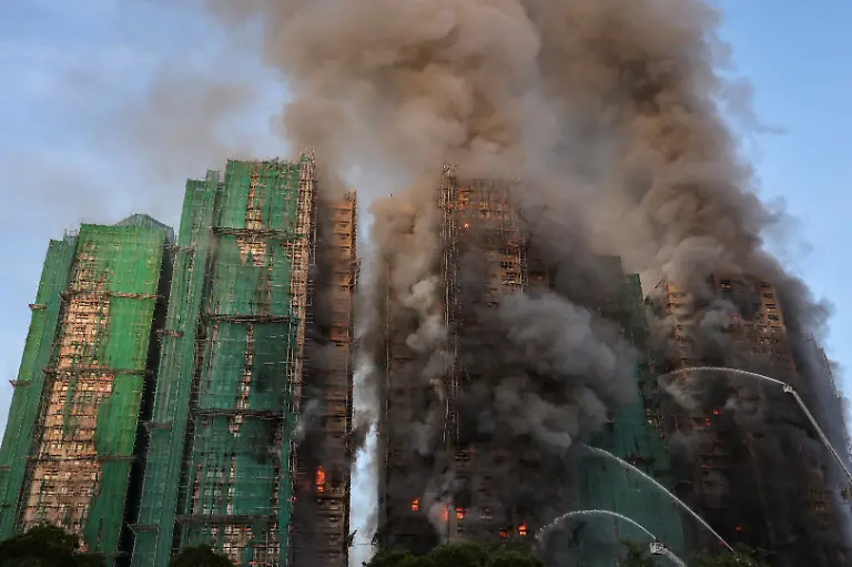 Flames-and-thick-smoke-rise-from-multiple-residential-blocks-at-the-Wang-Fuk-Court-housing-complex-during-a-deadly-fire-in-Tai-Po-Hong-Kong-China-November-26-2025-REUTERS-Tyrone-Siu-SEARCH-HONG-KONG-FIRE-PICTURE-FOR-THIS-STORY-SEARCH-WIDER-IMAGE-FOR-ALL-STORIES