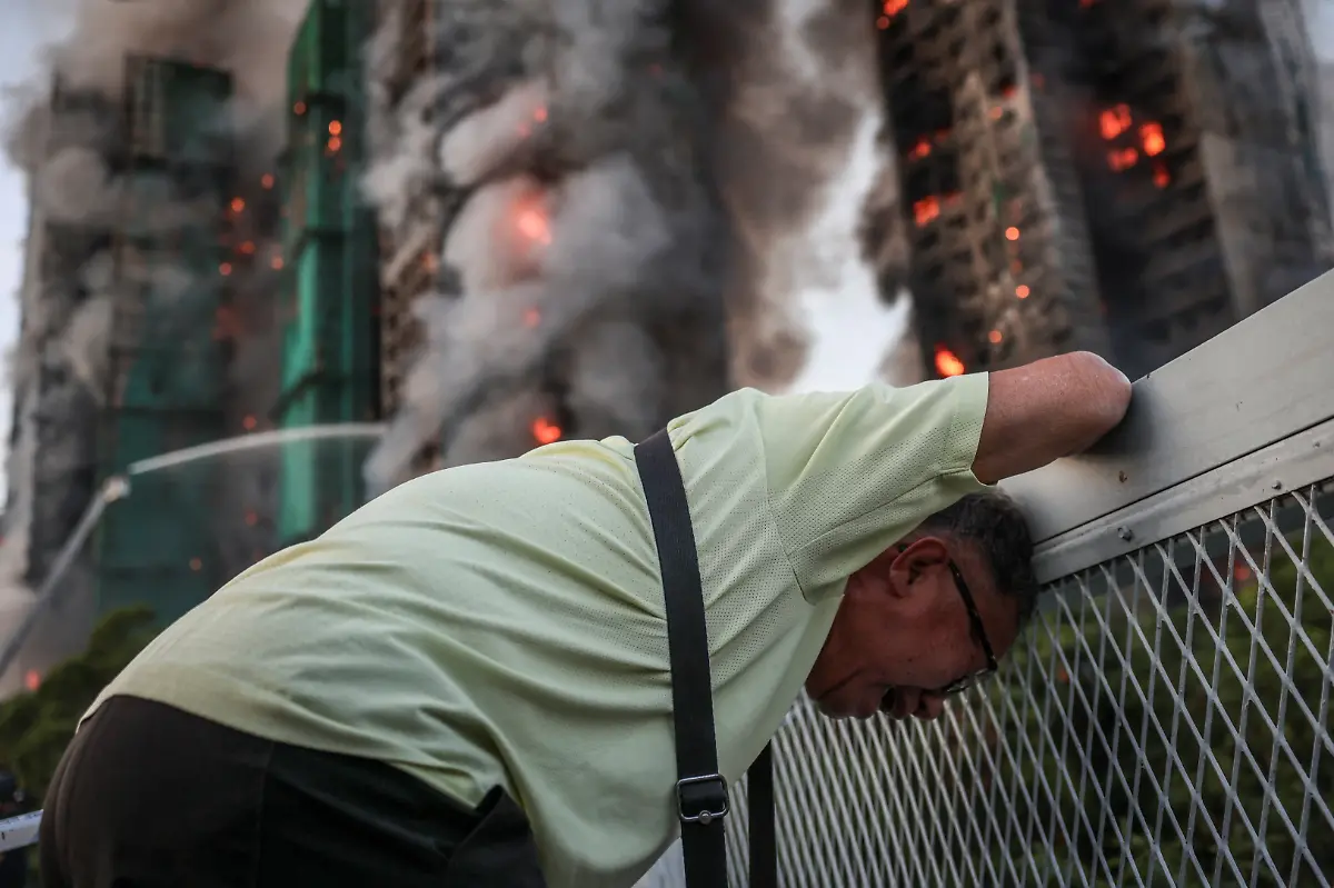 Wong-71-reacts-after-saying-his-wife-is-trapped-inside-Wang-Fuk-Court-during-a-major-fire-in-Tai-Po-Hong-Kong-China-November-26-2025-REUTERS-Tyrone-Siu-SEARCH-HONG-KONG-FIRE-PICTURE-FOR-THIS-STORY-SEARCH-WIDER-IMAGE-FOR-ALL-STORIES