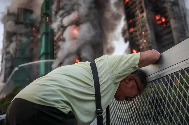Wong-71-reacts-after-saying-his-wife-is-trapped-inside-Wang-Fuk-Court-during-a-major-fire-in-Tai-Po-Hong-Kong-China-November-26-2025-REUTERS-Tyrone-Siu-SEARCH-HONG-KONG-FIRE-PICTURE-FOR-THIS-STORY-SEARCH-WIDER-IMAGE-FOR-ALL-STORIES