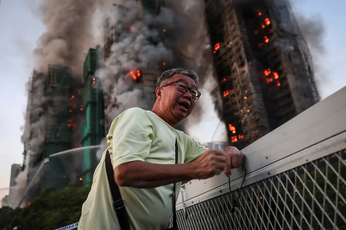 Wong-71-reacts-after-saying-his-wife-is-trapped-inside-Wang-Fuk-Court-during-a-major-fire-in-Tai-Po-Hong-Kong-China-November-26-2025-REUTERS-Tyrone-Siu-SEARCH-HONG-KONG-FIRE-PICTURE-FOR-THIS-STORY-SEARCH-WIDER-IMAGE-FOR-ALL-STORIES