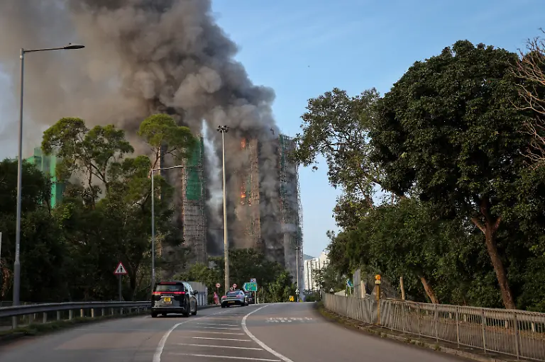Flames-and-thick-smoke-rise-from-multiple-residential-blocks-at-the-Wang-Fuk-Court-housing-complex-during-a-deadly-fire-in-Tai-Po-Hong-Kong-China-November-26-2025-REUTERS-Tyrone-Siu-SEARCH-HONG-KONG-FIRE-PICTURE-FOR-THIS-STORY-SEARCH-WIDER-IMAGE-FOR-ALL-STORIES