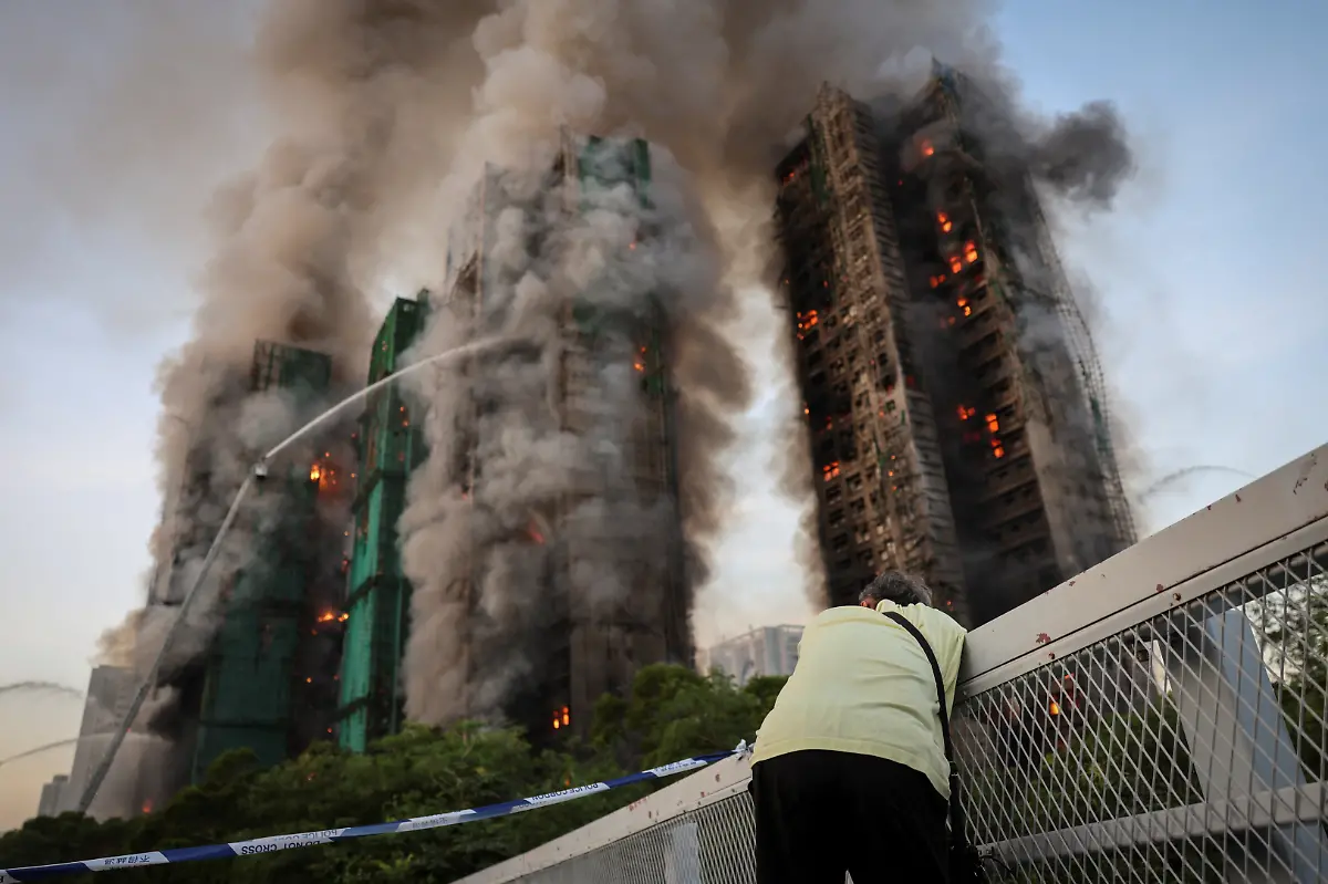 Wong-71-reacts-after-saying-his-wife-is-trapped-inside-Wang-Fuk-Court-during-a-major-fire-in-Tai-Po-Hong-Kong-China-November-26-2025-REUTERS-Tyrone-Siu-SEARCH-HONG-KONG-FIRE-PICTURE-FOR-THIS-STORY-SEARCH-WIDER-IMAGE-FOR-ALL-STORIES