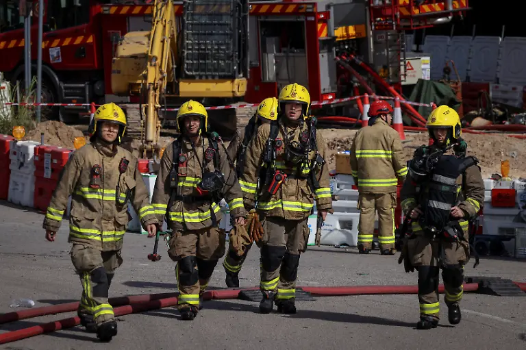 Firefighters-walk-near-the-site-of-a-deadly-fire-at-Wang-Fuk-Court-housing-complex-in-Tai-Po-Hong-Kong-China-November-28-2025-REUTERS-Tyrone-Siu-SEARCH-HONG-KONG-FIRE-PICTURE-FOR-THIS-STORY-SEARCH-WIDER-IMAGE-FOR-ALL-STORIES