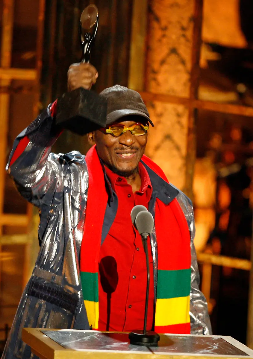 Jimmy-Cliff-raises-his-trophy-during-the-Rock-and-Roll-Hall-of-Fame-induction-ceremony-in-New-York-Monday-March-15-2010