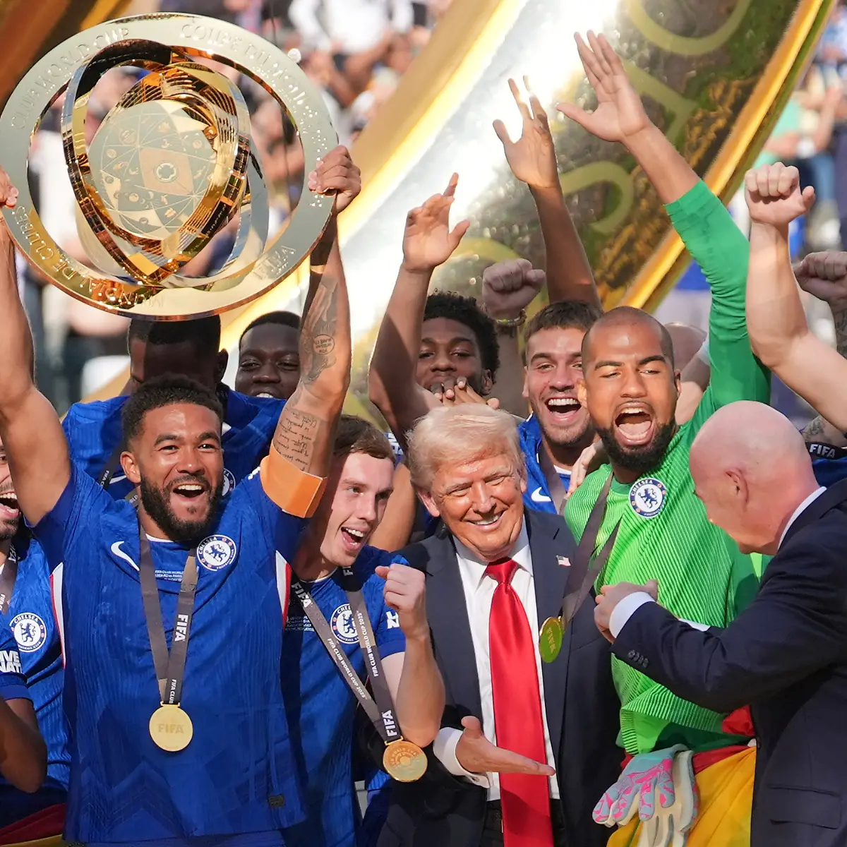 President-Donald-Trump-reaches-out-to-shake-hands-with-FIFA-President-Gianni-Infantino-as-Chelsea-s-Reece-James-24-lifts-the-trophy-following-the-Club-World-Cup-final-soccer-match-between-Chelsea-and-PSG-in-East-Rutherford-N-J-Sunday-July-13-2025