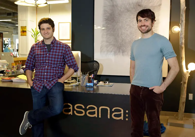 In-this-photo-taken-Thursday-April-3-2014-Asana-co-founders-Dustin-Moskovitz-left-and-Justin-Rosenstein-pose-at-the-company-s-headquarters-in-San-Francisco-Asana-peddles-software-that-combines-the-elements-of-a-communal-notebook-social-network-instant-messaging-application-and-online-calendar-to-enable-teams-of-employees-to-share-information-and-do-most-of-their-jobs-without-relying-on-email
