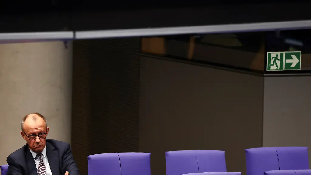 German-Chancellor-Friedrich-Merz-looks-on-as-members-of-the-parliament-vote-on-a-contentious-pensions-package-during-a-session-of-the-lower-house-of-parliament-the-Bundestag-in-Berlin-Germany-December-5-2025