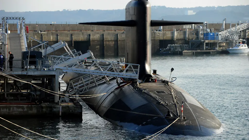 A-picture-taken-on-December-5-2016-shows-a-nuclear-submarine-at-the-naval-base-in-Ile-Longue-western-of-France-The-submarines-stay-invisible-for-70-days-in-the-depth-of-the-ocean-Their-mission-is-to-deliver-a-nuclear-weapon-when-the-French-President-give-the-order-Four-nuclear-powered-ballistic-missile-submarines-insure-the-French-nuclear-dissuasion