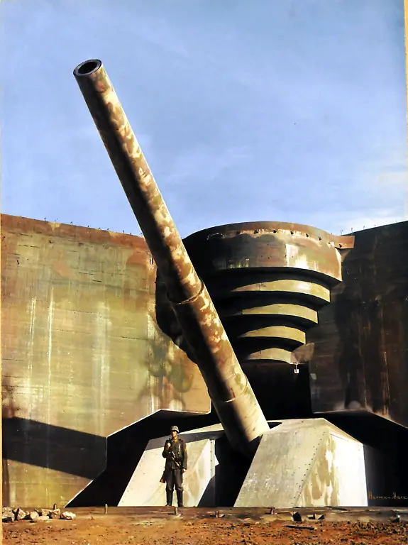 View-of-a-massive-piece-of-German-coastal-artillery-in-a-concrete-casement-on-the-Atlantic-Wall-France-early-1940s-A-German-soldier-stands-in-front-of-the-artillery-piece
