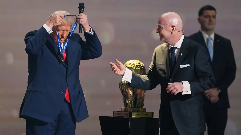 FIFA-President-Gianni-Infantino-presents-President-Donald-Trump-with-the-FIFA-Peace-Prize-during-the-draw-for-the-2026-soccer-World-Cup-at-the-Kennedy-Center-in-Washington-Friday-Dec-5-2025