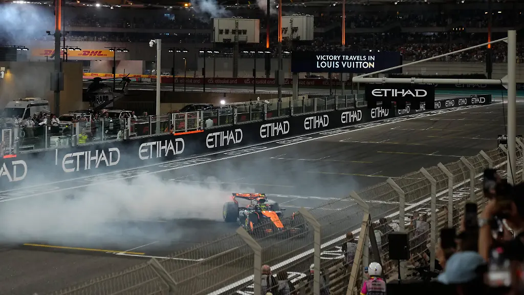 Third-placed-new-Formula-One-World-Champion-McLaren-driver-Lando-Norris-of-Britain-burns-tires-after-the-Formula-One-Abu-Dhabi-Grand-Prix-at-the-Yas-Marina-Circuit-in-Abu-Dhabi-UAE-Sunday-Dec-7-2025