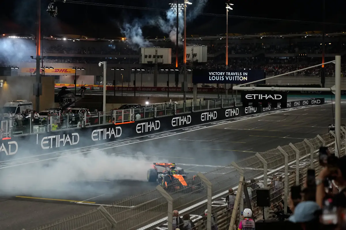 Third-placed-new-Formula-One-World-Champion-McLaren-driver-Lando-Norris-of-Britain-burns-tires-after-the-Formula-One-Abu-Dhabi-Grand-Prix-at-the-Yas-Marina-Circuit-in-Abu-Dhabi-UAE-Sunday-Dec-7-2025