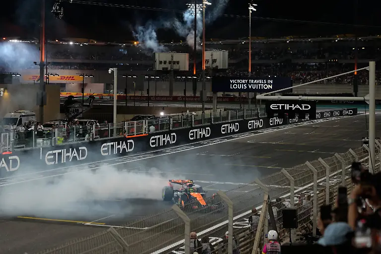 Third-placed-new-Formula-One-World-Champion-McLaren-driver-Lando-Norris-of-Britain-burns-tires-after-the-Formula-One-Abu-Dhabi-Grand-Prix-at-the-Yas-Marina-Circuit-in-Abu-Dhabi-UAE-Sunday-Dec-7-2025
