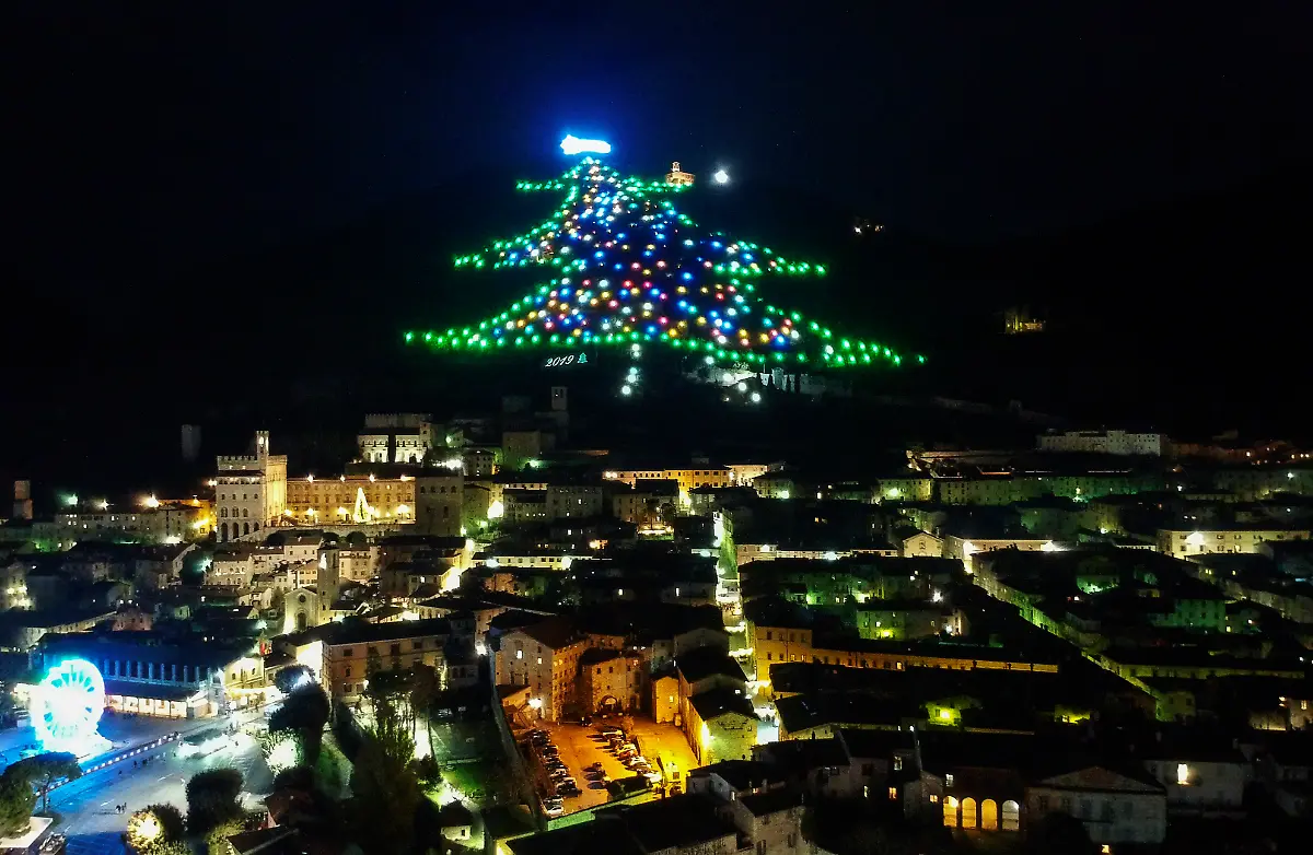 A-Christmas-tree-decorates-Monte-Ingino-which-dominates-the-city-of-Gubbio-in-the-Umbria-region-The-tree-is-650-meters-long-with-an-area-of-about-1-000-square-meters-and-covered-by-over-4000-lights-It-is-in-the-Guinness-Book-of-Records-as-the-largest-Christmas-tree-in-the-world