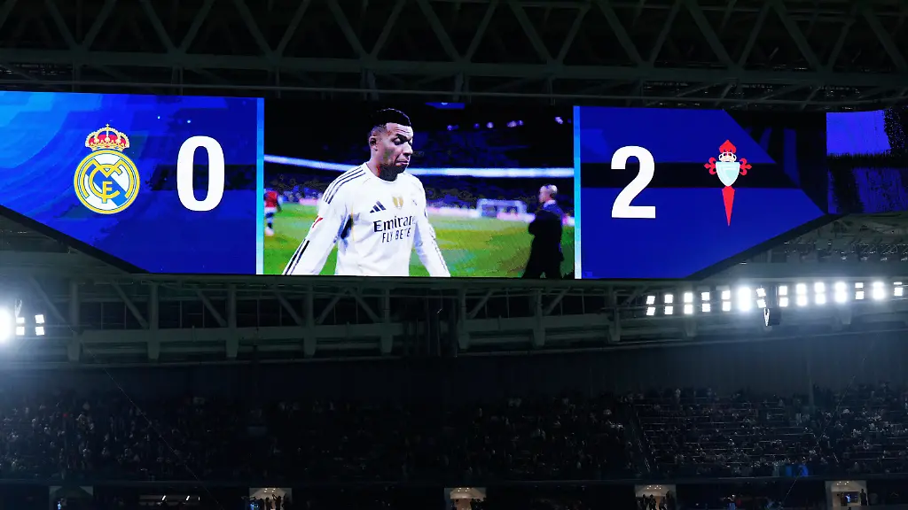 A-screen-shows-the-score-and-Real-Madrid-s-Kylian-Mbappe-leaving-the-field-at-the-end-of-the-Spanish-La-Liga-soccer-match-between-Real-Madrid-and-Celta-Vigo-in-Madrid-Spain-Sunday-Dec-7-2025