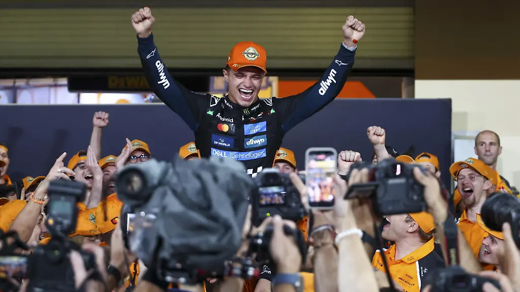 ABU-DHABI-UNITED-ARAB-EMIRATES-DECEMBER-7-Lando-Norris-of-McLaren-celebrates-becomes-F1-World-Champion-2025-with-his-team-after-the-F1-Grand-Prix-of-Abu-Dhabi-at-Yas-Marina-Circuit-on-December-4-2025-in-Abu-Dhabi-United-Arab-Emirates