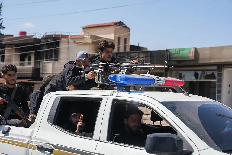 July-20-2025-Sweida-Syria-Syrian-security-forces-fighters-deploy-through-the-streets-of-Sweida-to-end-the-clashes-between-local-Druze-factions-and-Bedouin-tribes-which-resulted-in-dozens-of-casualties-and-heightened-tensions-in-the-city