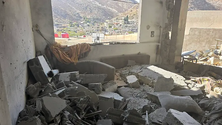 251128-DAMASCUS-Nov-28-2025-This-photo-taken-with-a-mobile-phone-shows-an-interior-view-of-a-destroyed-house-after-Israeli-airstrikes-in-Beit-Jinn-Syria-Nov-28-2025-Israeli-airstrikes-and-artillery-fire-killed-at-least-13-people-and-wounded-more-than-two-dozen-others-in-the-village-of-Beit-Jinn-in-the-southwestern-countryside-of-Damascus-early-Friday-Syrian-authorities-rescue-teams-and-eyewitnesses-said